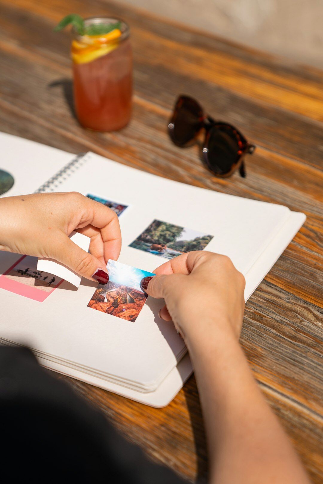 close up of hands holding photo album